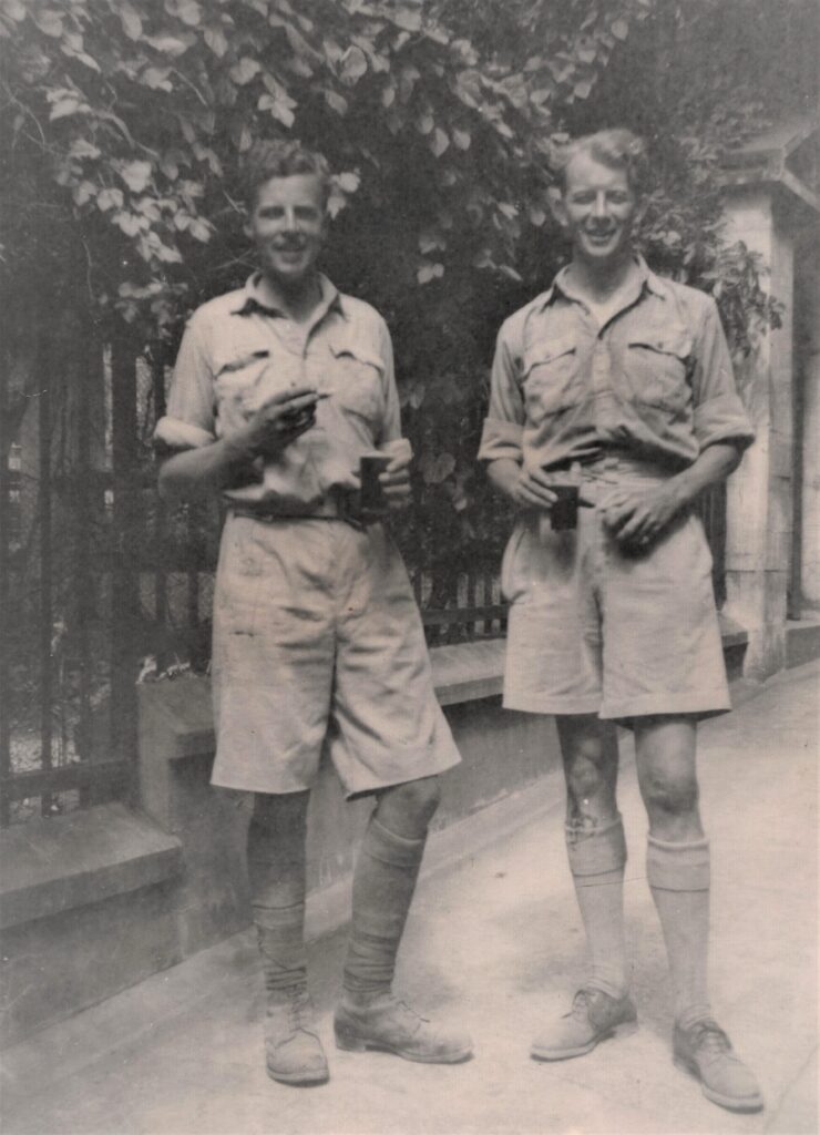 Major Kenyon, left, with Major Dusty Miller, enjoying drinks outside the library gardens mess, after a trial run on the Rock assault course, Gibraltar, May 1943.