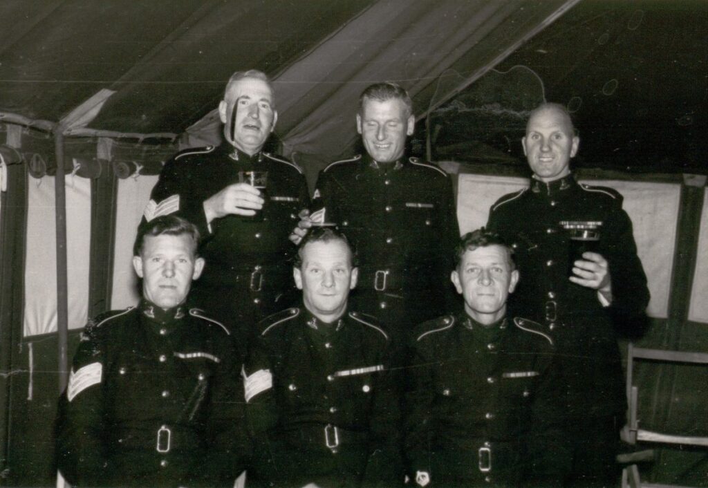 Warrant Officer Cliff North with Hertfordshire Regiment colleagues, circa 1950s